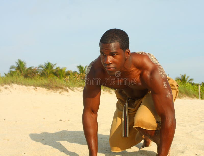 Athlete Training On The Beach