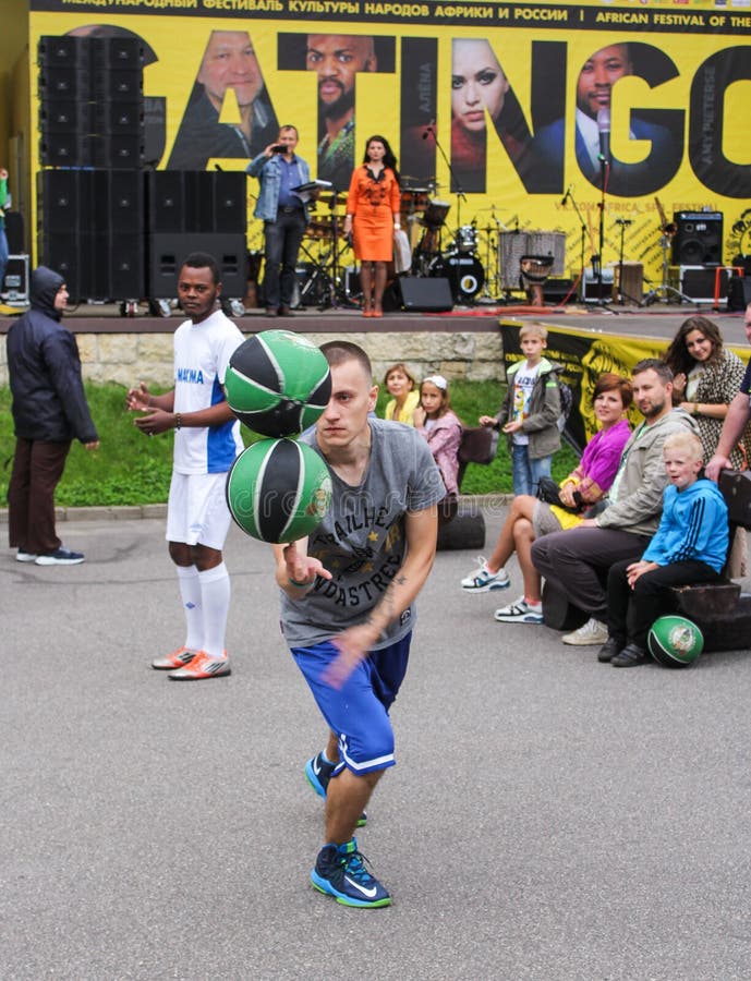 Young man with two balls. editorial photography. Image of football