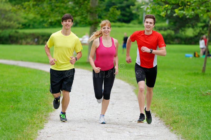 Athletes Jogging In The Park Stock Image Image of horizontal, nature