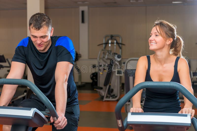 Athletes Training on Exercise Bikes at Gym Stock Image Image of