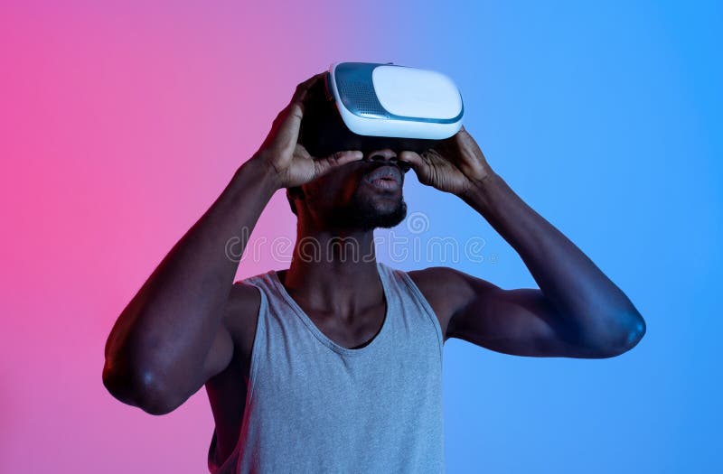 Athletic Black Guy Wearing VR Headset, Doing Virtual Workout in