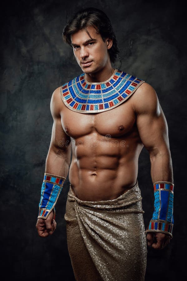 Athletic Man In Egyptian Costume Performing His Feats Of Strenght