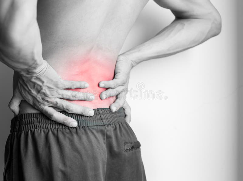 Athletic man`s back pain isolated in black and white stock images