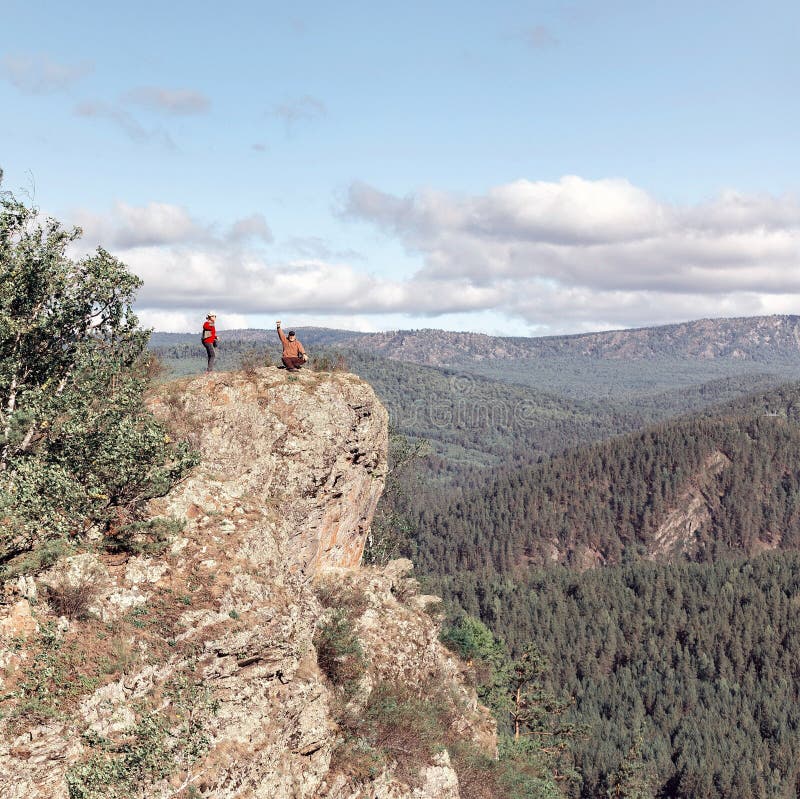 Mature Couple Stands On A High Rock Above The White River Against The Background Of The Ural