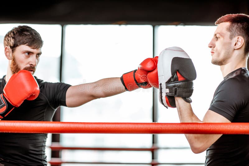 Man Training with Boxing Coach on the Boxing Ring Stock Photo Image of fighter, kick 137600744