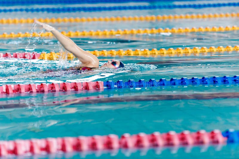 Woman swimming with swimming hat in swimming pool royalty free stock images Woman swimming with swimming hat in swimming pool royalty free stock images