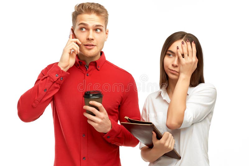 Athletic young man with blond hair talking on the phone with Cup of coffee in his hands stock photo Athletic young man with blond hair talking on the phone with Cup of coffee in his hands stock photo