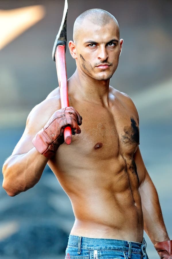 Athletic Young Man Running on Race Track with Sunset Background Stock