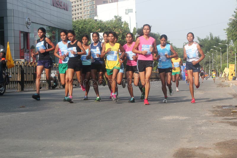 Bangalore, India - May 27: Professional woman athletes from India participate in Tata Consultancy Services World 10K Bangalore Marathon on May 27, 2012 in Bangalore, India. Bangalore, India - May 27: Professional woman athletes from India participate in Tata Consultancy Services World 10K Bangalore Marathon on May 27, 2012 in Bangalore, India.