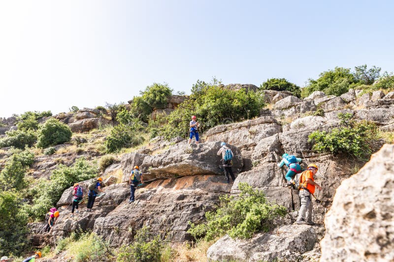 Tiberias, Israel, April 23, 2024 : Professional athletes with special equipment overcome the Via Ferrata Ravid route in the mountains near Tiberias in northern Israel. Tiberias, Israel, April 23, 2024 : Professional athletes with special equipment overcome the Via Ferrata Ravid route in the mountains near Tiberias in northern Israel