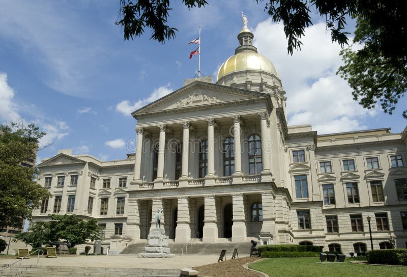 Georgia State Capitol Building or State House, Atlanta. Building with dome, columns and a statue by the front steps. Georgia State Capitol Building or State House, Atlanta. Building with dome, columns and a statue by the front steps.