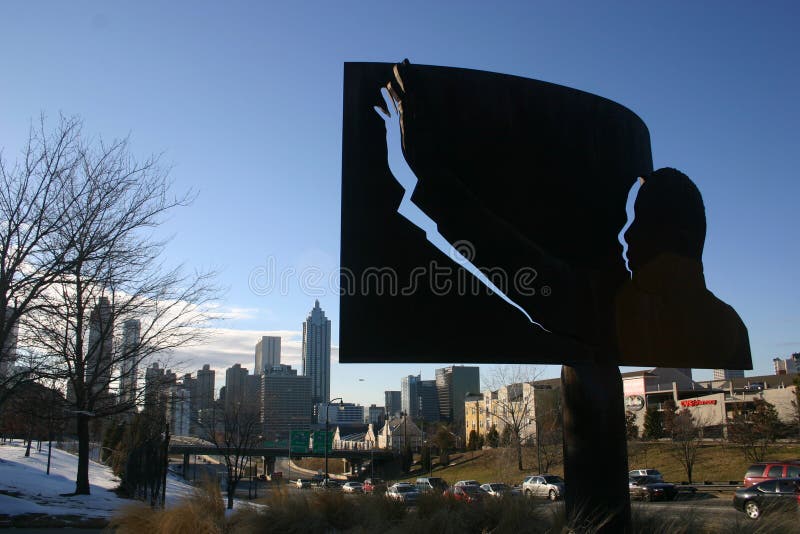 Atlanta, GA - JAN 15: On what would have been his 82nd birthday, a statue of Martin Luther King Jr stands over the Atlanta skyline on January 15, 2011, two days before the national holiday in his honor. Atlanta, GA - JAN 15: On what would have been his 82nd birthday, a statue of Martin Luther King Jr stands over the Atlanta skyline on January 15, 2011, two days before the national holiday in his honor.