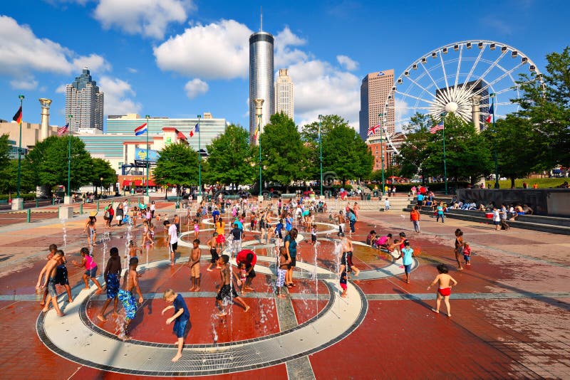 Children play at Centennial Olympic Park August 25, 2013 in Atlanta, GA. The park commemorates the 1996 Atlanta Olympics. Children play at Centennial Olympic Park August 25, 2013 in Atlanta, GA. The park commemorates the 1996 Atlanta Olympics.