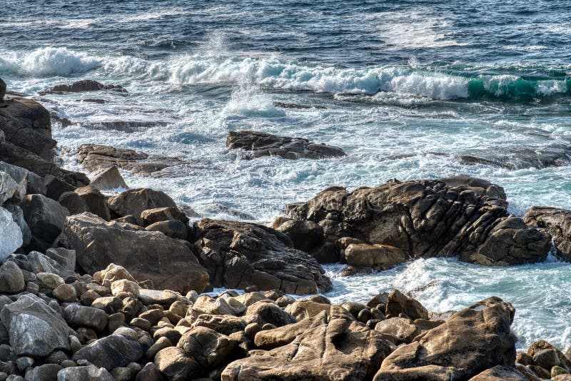 Atlantic Ocean. Pacific ocean waves crashing on rocks foaming in the water royalty free stock images Atlantic Ocean. Pacific ocean waves crashing on rocks foaming in the water royalty free stock images