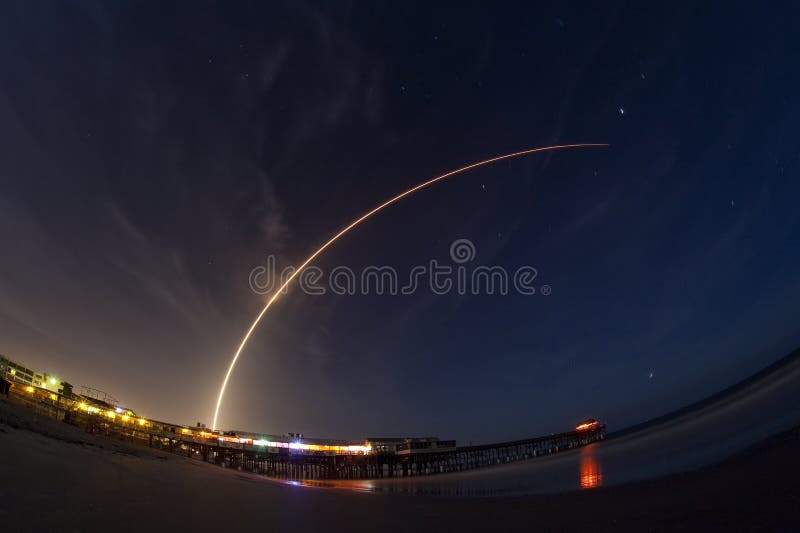 A two minute time exposure of the Altas V launch from Cape Canaveral Air Force Station, Florida. The 19-story United Launch Alliance Atlas V rocket carrying twin NASA satellites lifts off from Launch Complex 41. The photo was taken on the beach at Cocoa Beach with the fishing pier in the foreground.