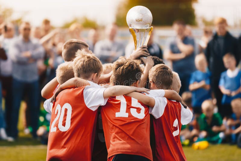 Young Athletes from School Sports Team Holding Winning Trophy. Kids Champion Sport Team. Boys Holding Prize Cup. Children Rising Winner Golden Cup. Boys Celebrating Sports Championship. Young Athletes from School Sports Team Holding Winning Trophy. Kids Champion Sport Team. Boys Holding Prize Cup. Children Rising Winner Golden Cup. Boys Celebrating Sports Championship