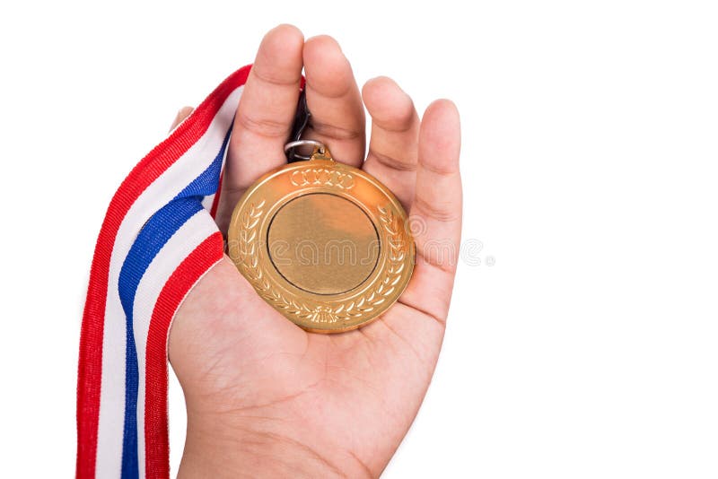 Atlety mienia złoty medal z faborkiem na jego ręce zdjęcie stock Atlety mienia złoty medal z faborkiem na jego ręce zdjęcie stock