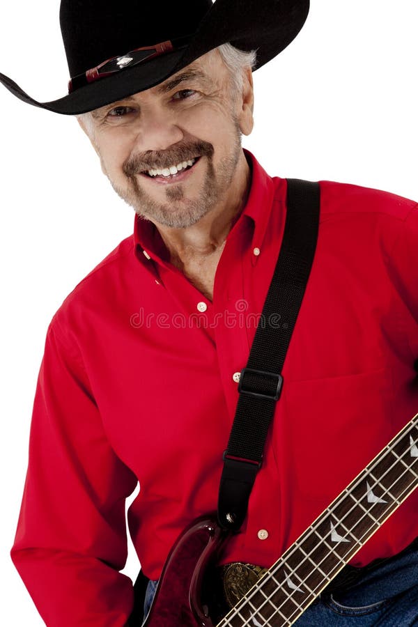 Atrakcyjny Szczęśliwy Starszych osob Mężczyzna z Gitarą i Cowbo zdjęcia royalty free Atrakcyjny Szczęśliwy Starszych osob Mężczyzna z Gitarą i Cowbo zdjęcia royalty free