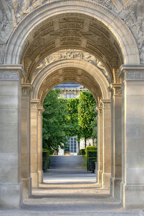 View through Arc de Triomphe du Carrousel, a triumphal arch in Paris, France. View through Arc de Triomphe du Carrousel, a triumphal arch in Paris, France