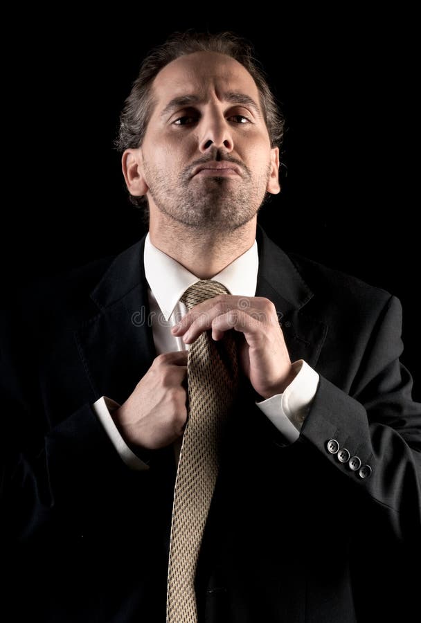 Attache de relation étroite d'homme d'affaires, expression accablée photographie stock Attache de relation étroite d'homme d'affaires, expression accablée photographie stock