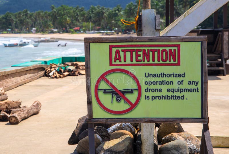 Attention sign prohibiting drone use by sea. Unauthorized operation of drone is prohibited inscription royalty free stock images Attention sign prohibiting drone use by sea. Unauthorized operation of drone is prohibited inscription royalty free stock images