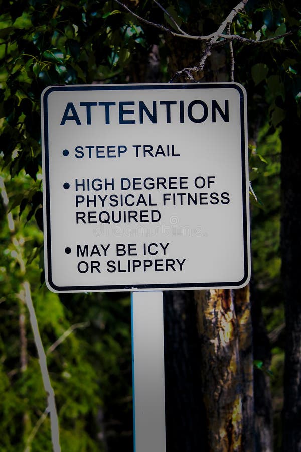 An Attention Steep Trail Sign with Additional Warnings Stock Image