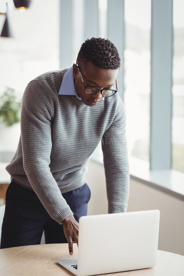 Attentive Executive Using Laptop at Desk Stock Image Image of electronic, focused 91792999