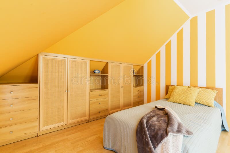Attic Bedroom With Intense Yellow Walls Stock Image Image