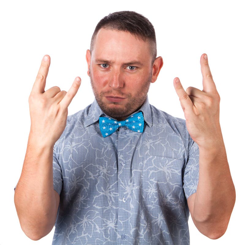 Attractive adult man with beard in a blue bow tie in summer shirt showing gesture hands of rock