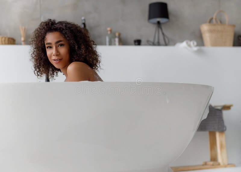 Attractive Afro American Woman Taking Bath And Smiling Stock Image