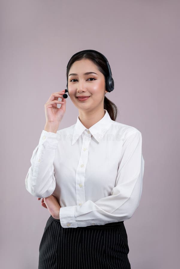 Attractive Asian operator with formal suit and headset. Enthusiastic stock image