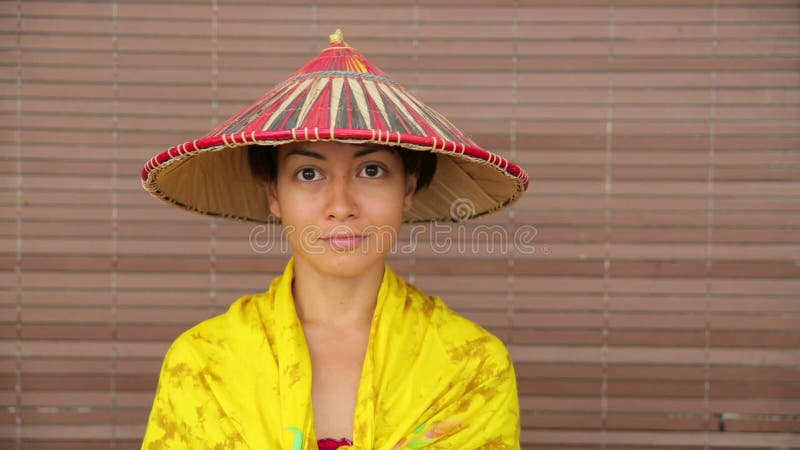 Attractive asian lady with hat stock video footage
