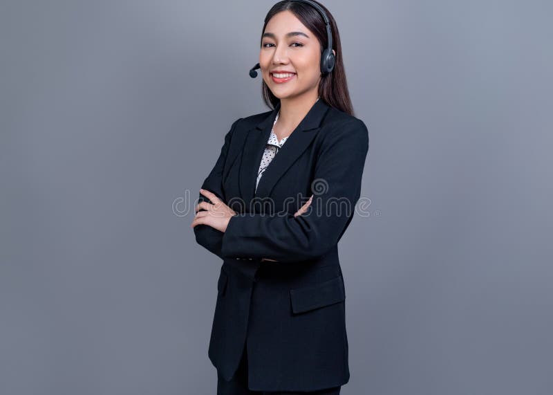 Attractive Asian operator with formal suit and headset. Jubilant stock photos