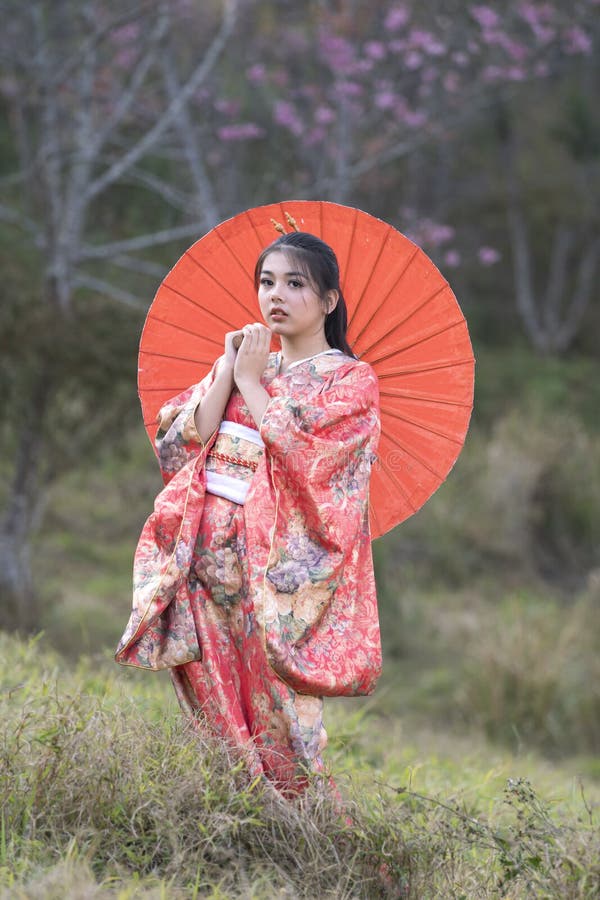 Attractive Asian Woman Wearing Kimono and Sakura Flowers. Asian Girl in ...