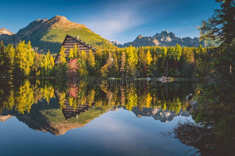 Attractive autumn view of Strbske pleso lake. Calm morning scene of High Tatras National Park, Slovakia, Europe. Beauty of nature