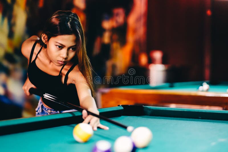 Premium Photo  Beautiful young girl came on a weekend to play billiards  for curiosity concept of a girl playing billiards