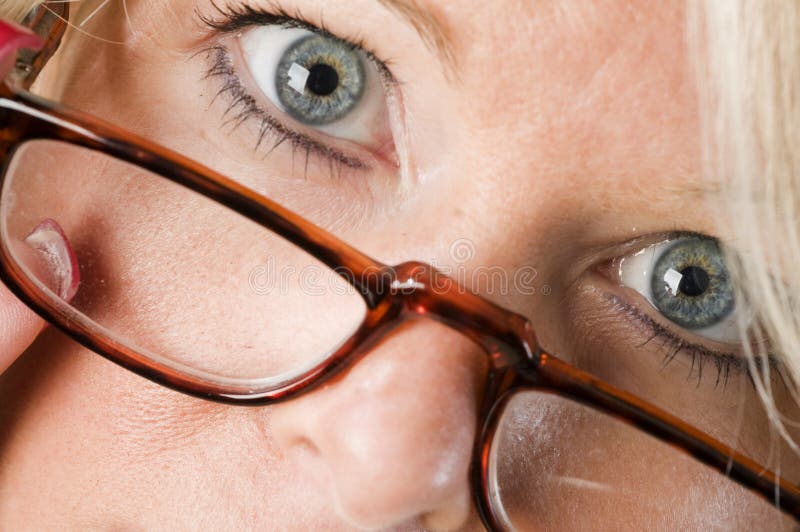 attractive blond woman reading glasses