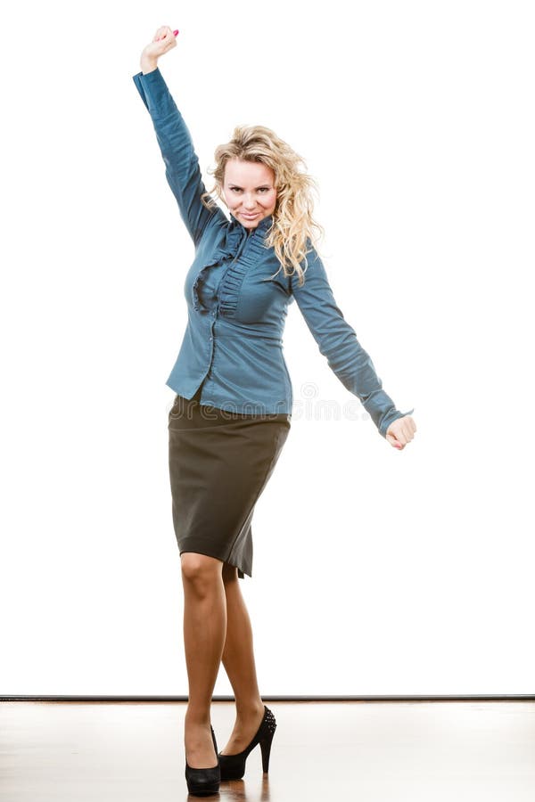 Portrait of funny middle aged blonde woman. Adult female wearing blue blouse and black skirt having fun in studio. Portrait of funny middle aged blonde woman. Adult female wearing blue blouse and black skirt having fun in studio.