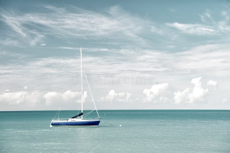 Attractive bright view of exotic colorful beautiful marine beach with boat on blue water