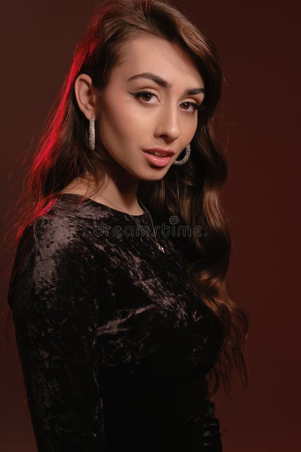 Attractive Brunette Lady In Stylish Jewelry And Black Velvet Dress ...