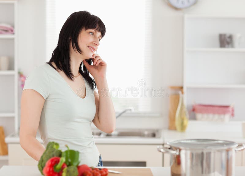 Attractive brunette woman on the phone