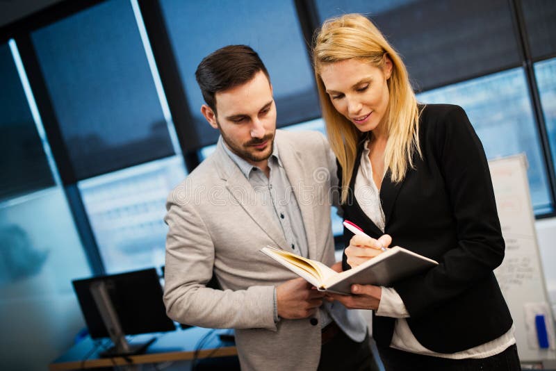 Attractive business couple having discussion in office royalty free stock photo Attractive business couple having discussion in office royalty free stock photo