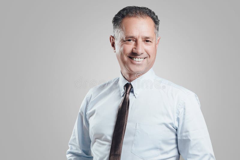 Attractive business man portrait on gray background