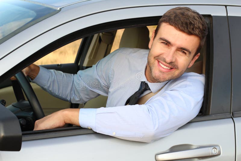 Attractive businessman driving a car