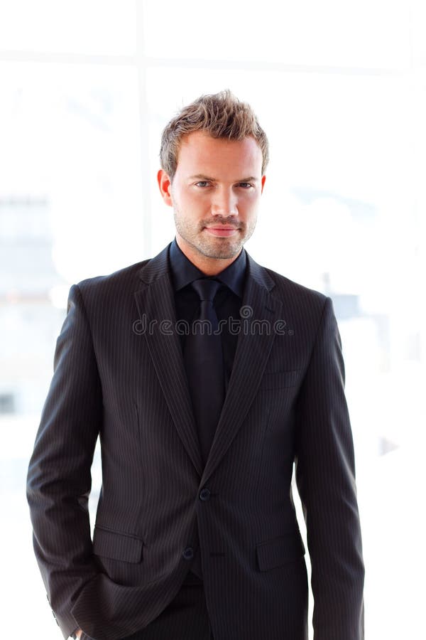 Attractive businessman looking at the camera