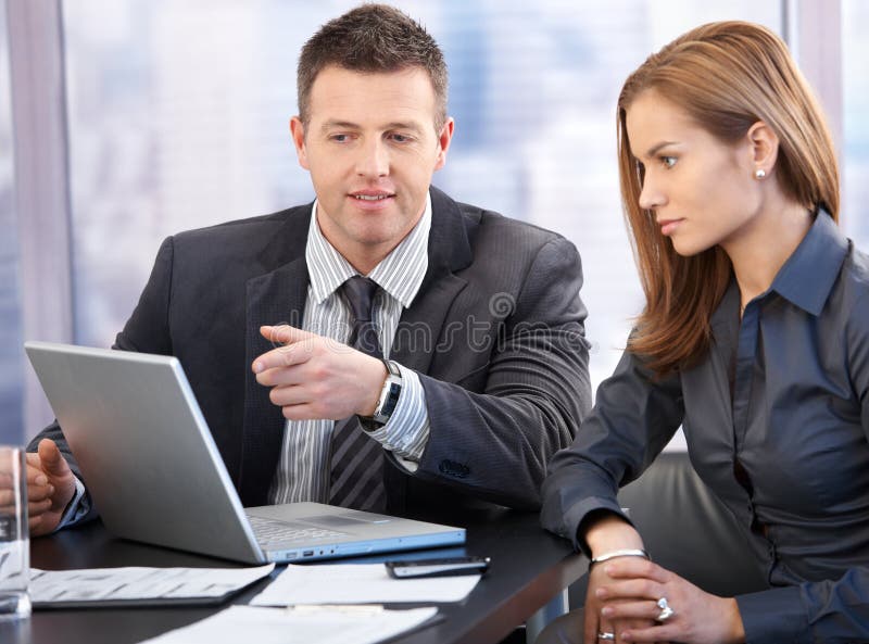 Attractive young businesspeople having discussion in boardroom. Negotiating table stock images, royalty-free photos and pictures