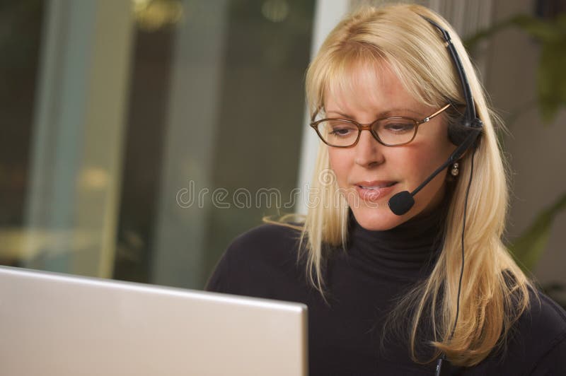 Attractive Businesswoman with Phone Headset