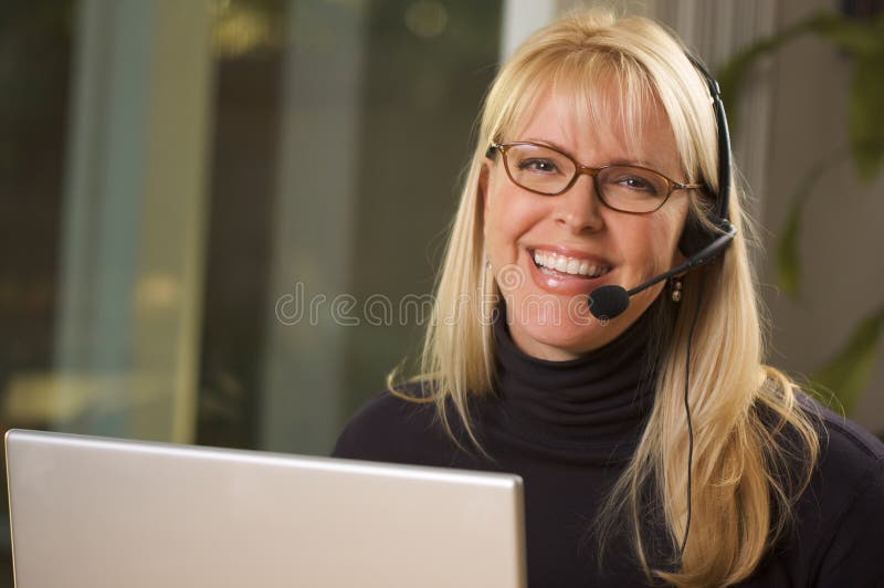 Attractive Businesswoman with Phone Headset