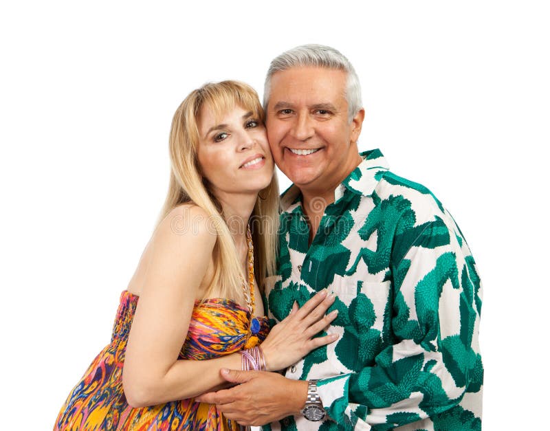 Attractive middle age couple in an affectionate pose with colorful clothes on a white background. Attractive middle age couple in an affectionate pose with colorful clothes on a white background.