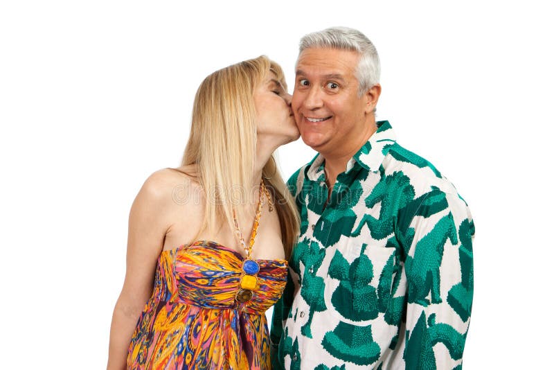 Attractive middle age couple in an affectionate pose with colorful clothes on a white background. Attractive middle age couple in an affectionate pose with colorful clothes on a white background.